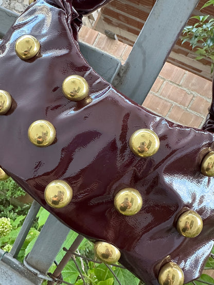 BORSA MEZZALUNA CON BORCHIE