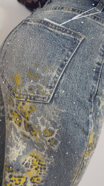 JEANS MACULATO CON STRASS